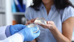 woman holding breastimplant